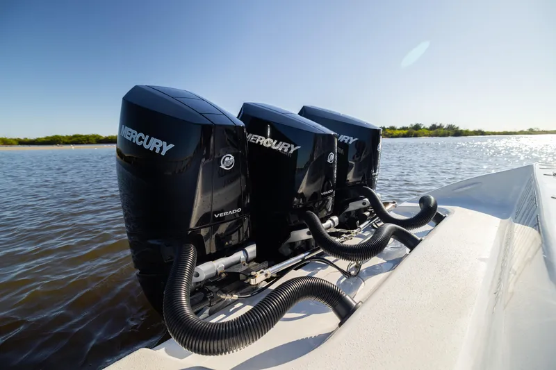 Bid Time 2 Yacht Photos Pics Triple Mercury Verado engines on 2023 Yellowfin 36 Offshore boat in sunny waters.