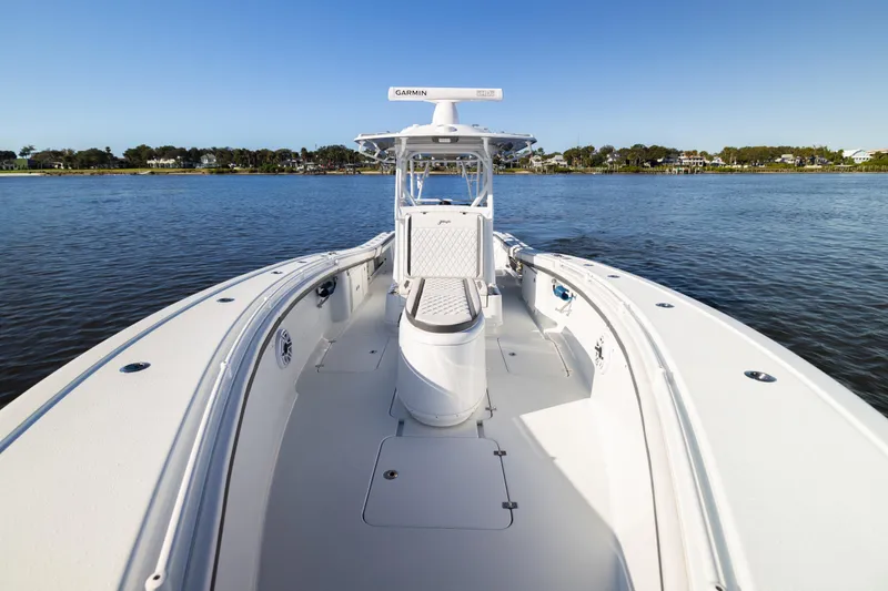 Bid Time 2 Yacht Photos Pics 2023 Yellowfin 36 Offshore boat on calm water, clear sky background.