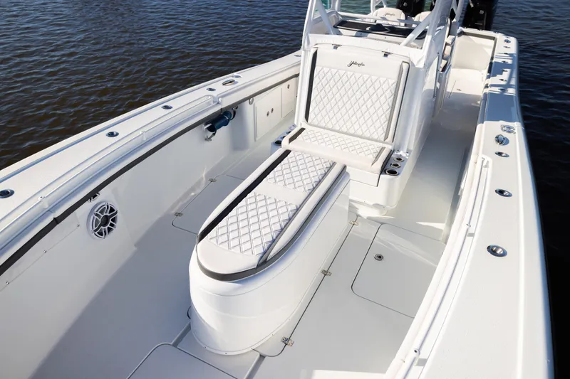 Bid Time 2 Yacht Photos Pics 2023 Yellowfin 36 Offshore boat interior with white seating and sleek design.
