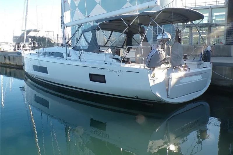 Skyfall Yacht Photos Pics 2025 Beneteau Oceanis 46.1 yacht docked in marina, reflecting on calm water.