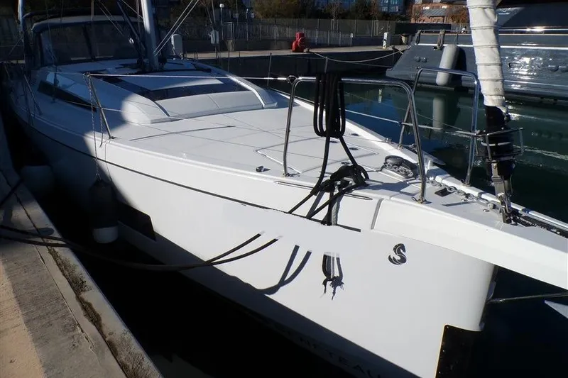 Skyfall Yacht Photos Pics 2025 Beneteau Oceanis 46.1 yacht docked in marina, side view.