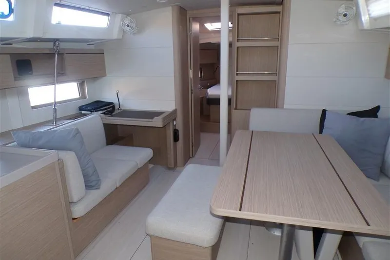 Skyfall Yacht Photos Pics 2025 Beneteau Oceanis 46.1 interior with modern seating and dining area.