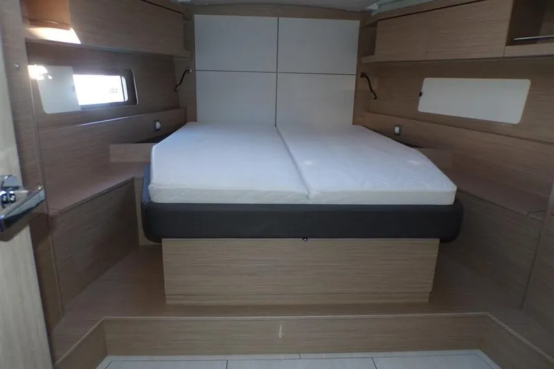 Skyfall Yacht Photos Pics 2025 Beneteau Oceanis 46.1 yacht cabin with modern wood interior and comfortable bed.