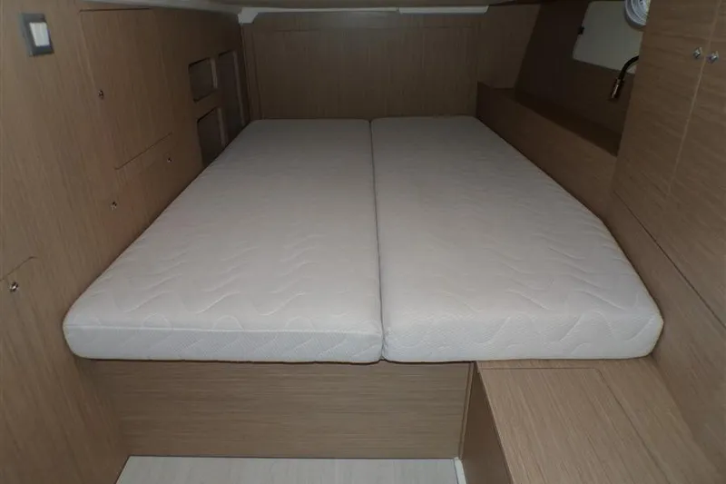 Skyfall Yacht Photos Pics 2025 Beneteau Oceanis 46.1 cabin interior with double bed and wooden finish.