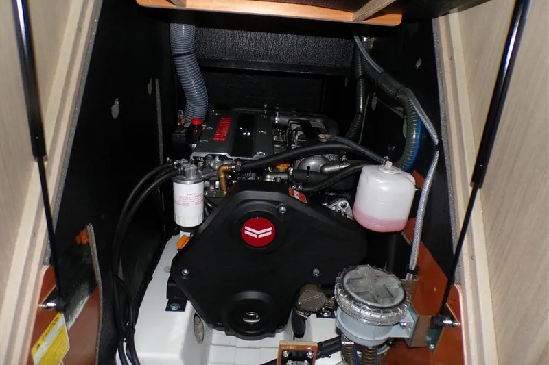 Skyfall Yacht Photos Pics Engine compartment of 2025 Beneteau Oceanis 46.1 sailboat, showcasing mechanical components.