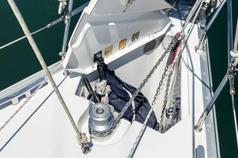  Yacht Photos Pics Anchor locker of 2002 Jeanneau Sun Odyssey 43 sailboat with ropes and winch.