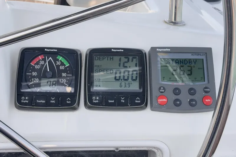  Yacht Photos Pics Instrument panel on a 2002 Jeanneau Sun Odyssey 43 sailboat, displaying depth, speed, and autopilot settings.