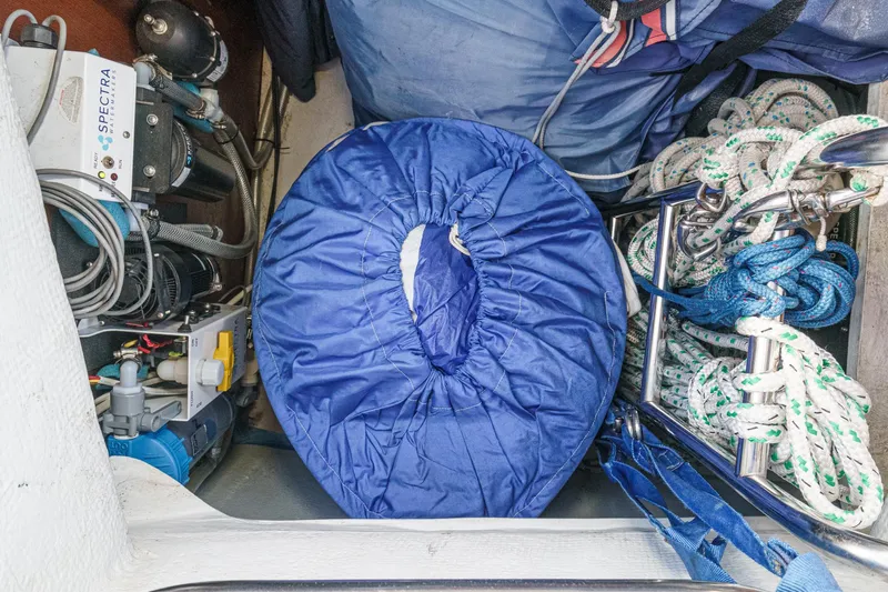  Yacht Photos Pics Storage compartment of 2002 Jeanneau Sun Odyssey 43 with ropes and equipment.