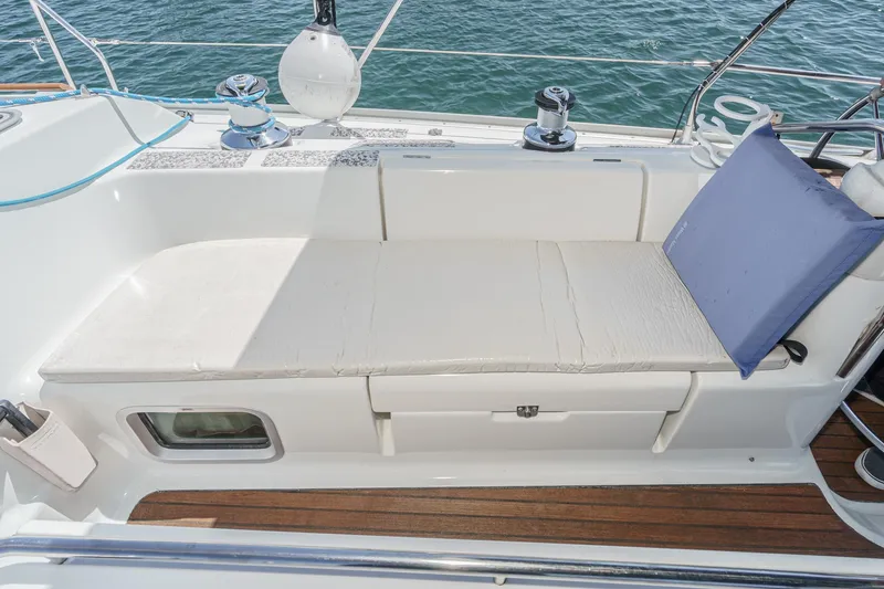  Yacht Photos Pics Jeanneau Sun Odyssey 43 sailboat deck with cushioned seating, 2002 model.