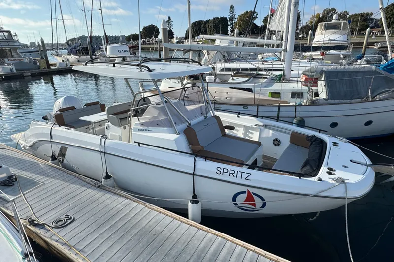 Spritz Yacht Photos Pics 2022 Beneteau Flyer 9 SPACEdeck boat docked at marina, featuring sleek design and spacious deck.