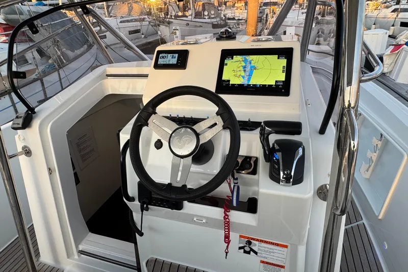 Spritz Yacht Photos Pics Cockpit of 2022 Beneteau Flyer 9 SPACEdeck with navigation display and steering wheel.
