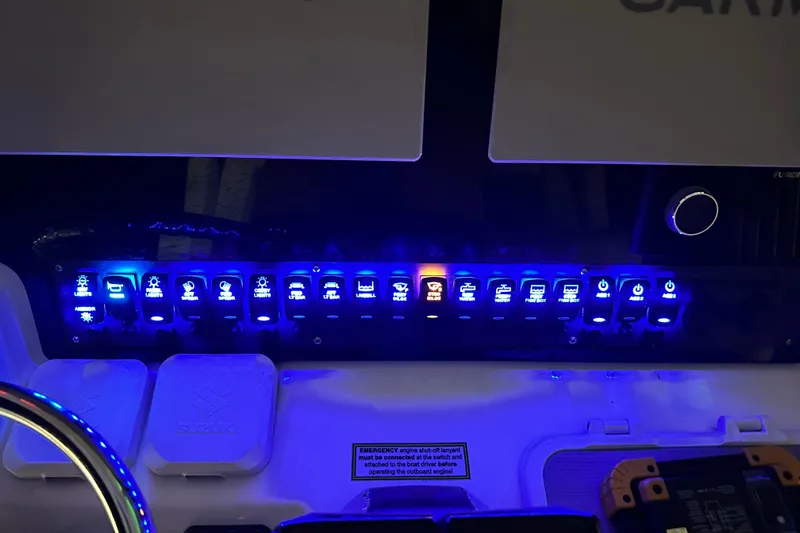  Yacht Photos Pics Control panel of 2022 Twin Vee 280 GFX CC boat with illuminated switches.