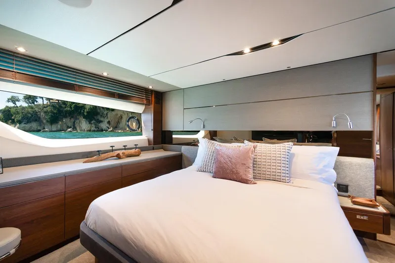 M/y Far Away Yacht Photos Pics Luxurious 2019 Princess S65 yacht bedroom with elegant decor and scenic window view.