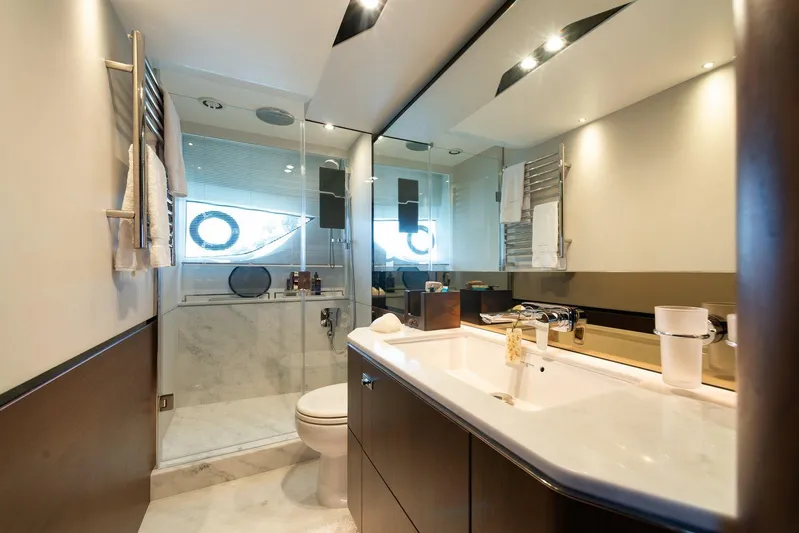 M/y Far Away Yacht Photos Pics Luxurious bathroom in 2019 Princess S65 yacht with modern fixtures and elegant design.