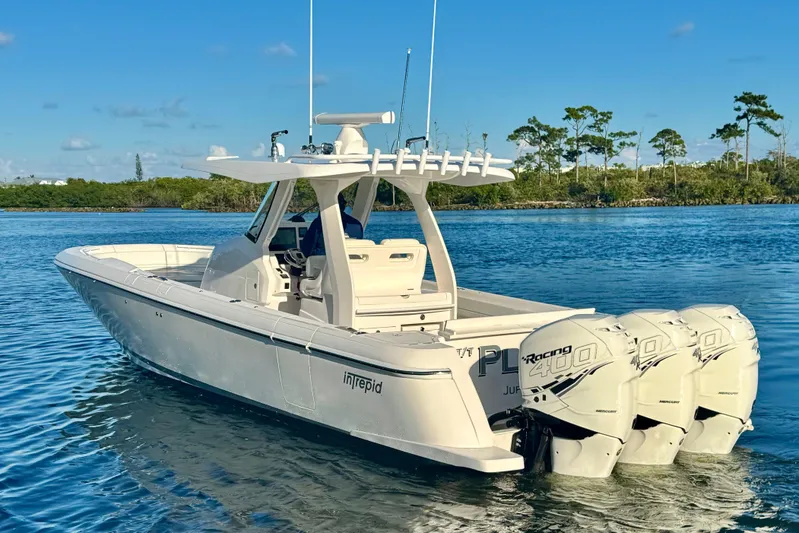  Yacht Photos Pics 2020 Intrepid 375 Nomad SE boat with triple Mercury Racing 400 engines on calm water.