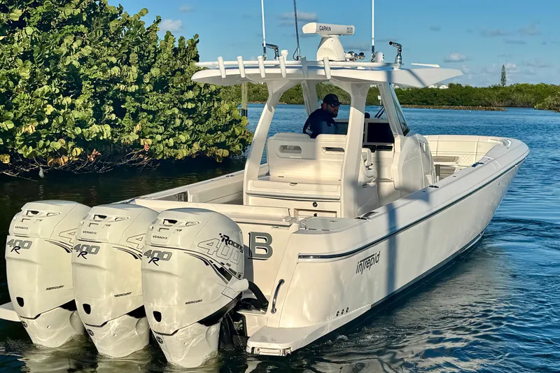  Yacht Photos Pics 2020 Intrepid 375 Nomad SE boat with triple Mercury 400R engines on calm water.