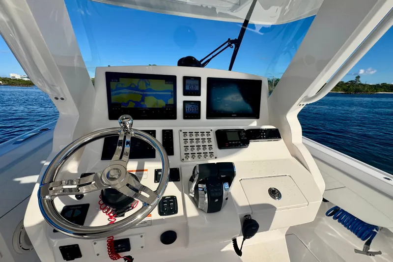  Yacht Photos Pics 2020 Intrepid 375 Nomad SE helm with advanced navigation displays and controls.