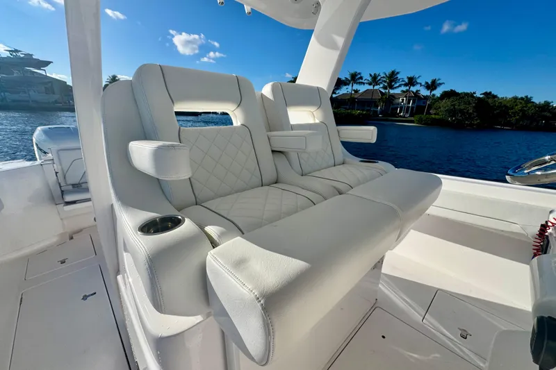  Yacht Photos Pics Luxurious seating on 2020 Intrepid 375 Nomad SE boat, with scenic waterfront view.