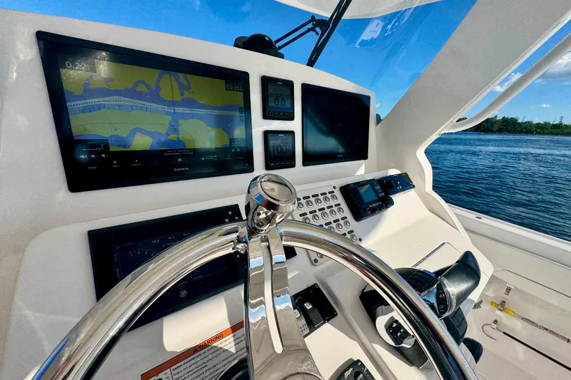 Yacht Photos Pics Cockpit of 2020 Intrepid 375 Nomad SE with navigation screens and steering wheel.