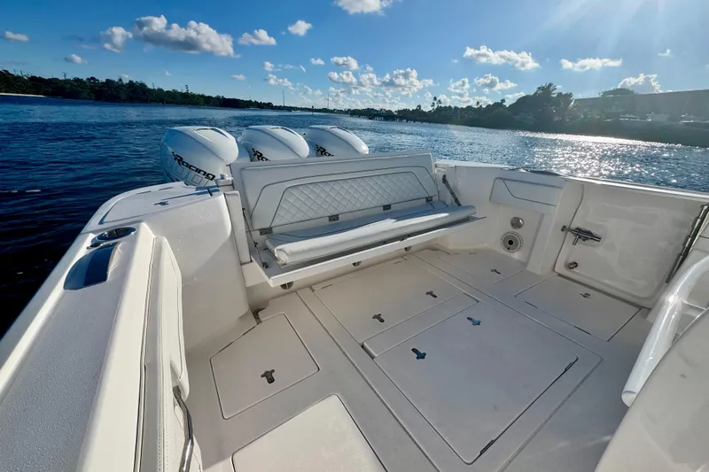  Yacht Photos Pics 2020 Intrepid 375 Nomad SE boat interior with triple outboard engines on a sunny day.