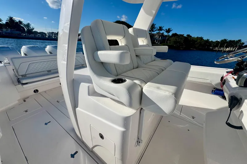  Yacht Photos Pics 2020 Intrepid 375 Nomad SE boat interior with luxurious seating and steering wheel.