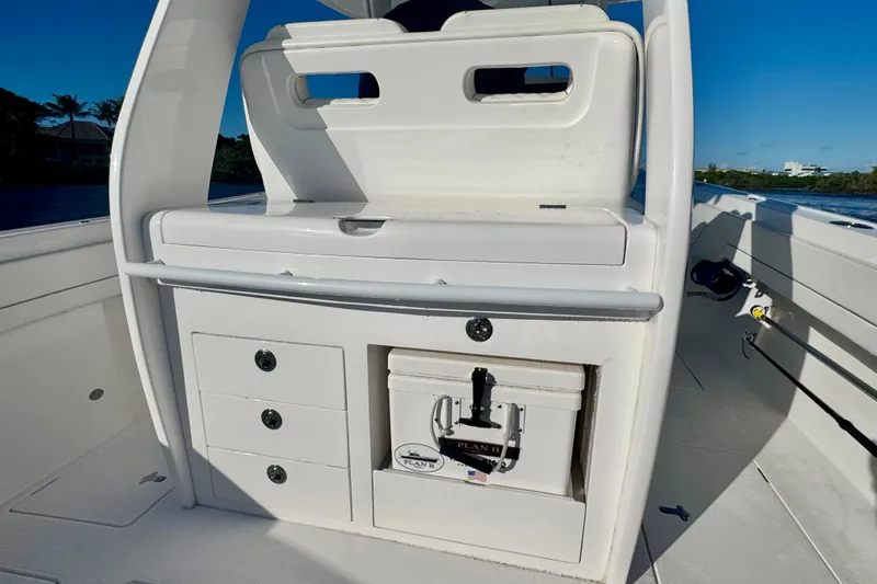  Yacht Photos Pics 2020 Intrepid 375 Nomad SE boat interior with storage compartments and cooler.