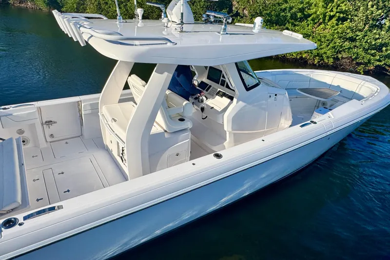  Yacht Photos Pics 2020 Intrepid 375 Nomad SE boat on water, showcasing sleek design and spacious deck.