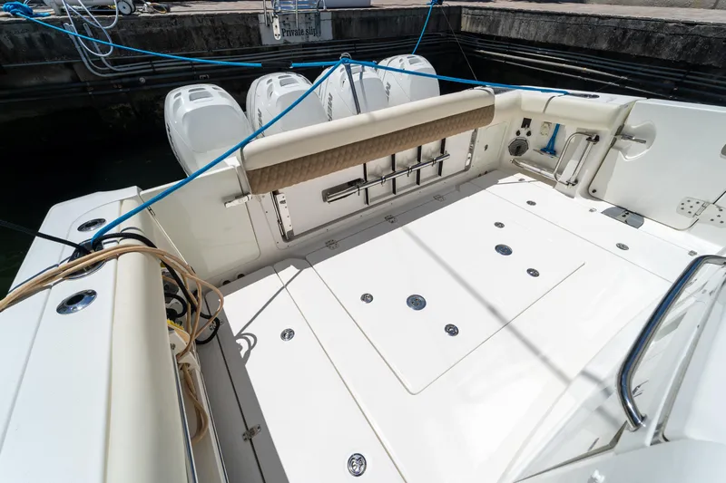  Yacht Photos Pics 2017 Boston Whaler 420 Outrage boat deck with seating and storage compartments.