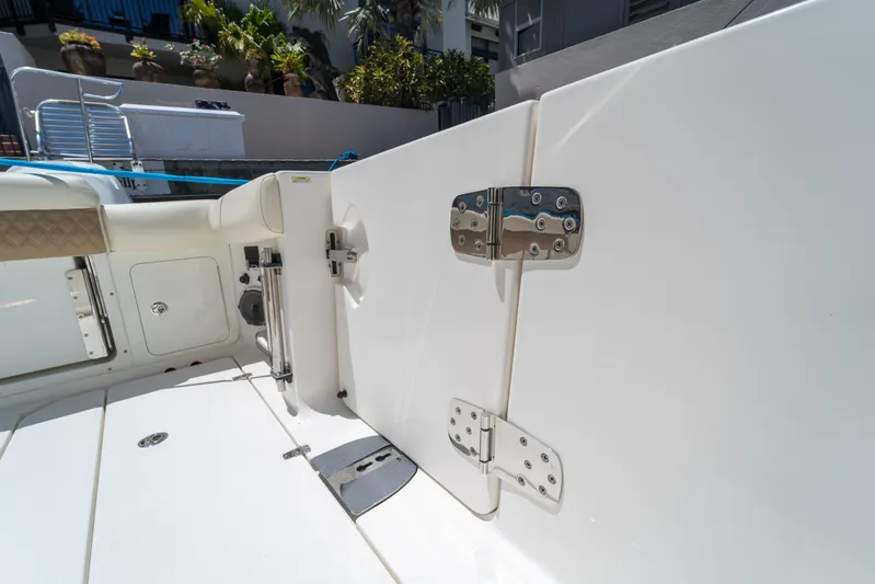  Yacht Photos Pics 2017 Boston Whaler 420 Outrage boat deck with stainless steel hinges and seating area.