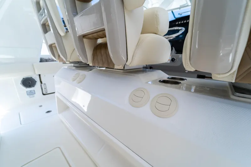  Yacht Photos Pics 2017 Boston Whaler 420 Outrage interior seating and controls, showcasing luxury and functionality.