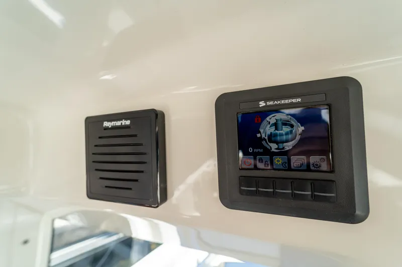 Yacht Photos Pics Control panel on 2017 Boston Whaler 420 Outrage boat, featuring Raymarine and Seakeeper displays.