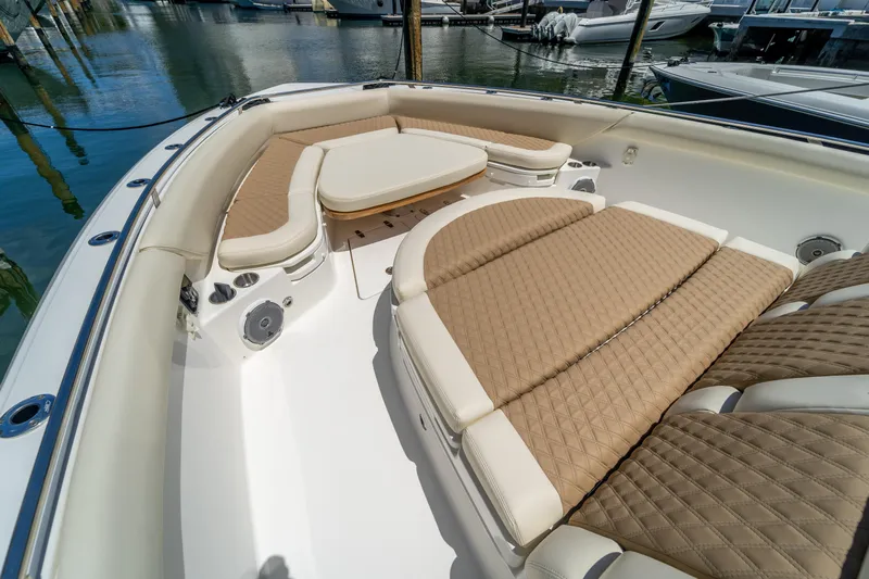  Yacht Photos Pics 2017 Boston Whaler 420 Outrage boat with luxurious seating and table in marina.