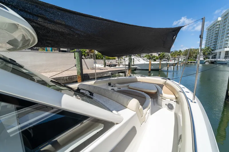  Yacht Photos Pics 2017 Boston Whaler 420 Outrage boat docked, featuring shaded seating area.