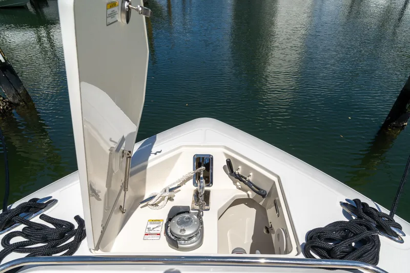  Yacht Photos Pics 2017 Boston Whaler 420 Outrage anchor compartment with ropes and water reflection.