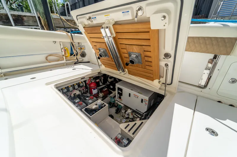  Yacht Photos Pics 2017 Boston Whaler 420 Outrage engine compartment with equipment and storage.