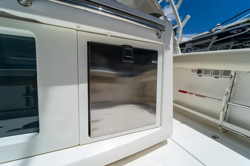 Yacht Photos Pics 2017 Boston Whaler 420 Outrage boat interior with stainless steel storage compartment.
