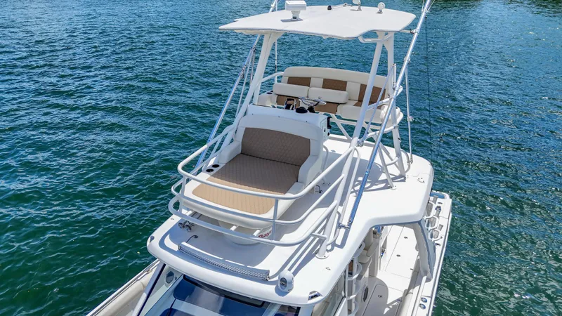  Yacht Photos Pics 2017 Boston Whaler 420 Outrage boat on water, featuring upper deck seating.