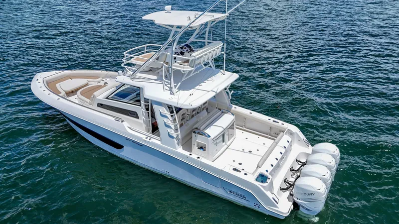  Yacht Photos Pics 2017 Boston Whaler 420 Outrage boat on open water, featuring multiple outboard engines.