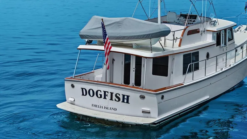 Dogfish Yacht Photos Pics 2023 Krogen Express 52 yacht named "Dogfish" on blue water near Amelia Island.