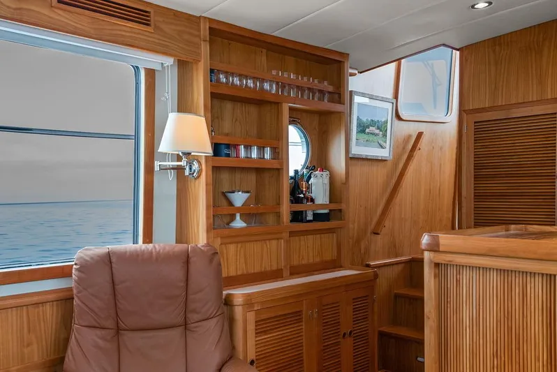Dogfish Yacht Photos Pics Luxurious interior of 2023 Krogen Express 52 yacht with wooden finishes and ocean view.