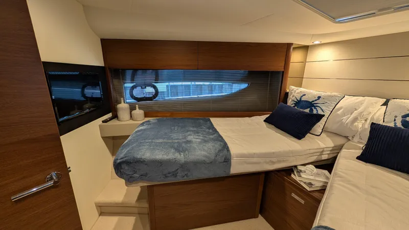  Yacht Photos Pics Luxurious cabin interior of 2021 Princess V50 yacht with cozy bedding and modern design.