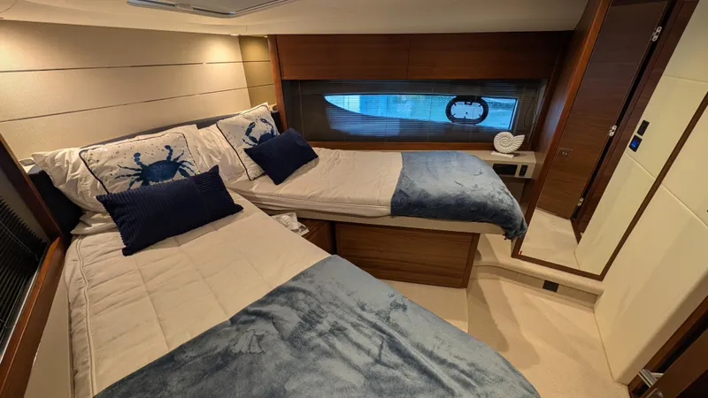  Yacht Photos Pics Luxurious 2021 Princess V50 yacht cabin with twin beds and elegant decor.
