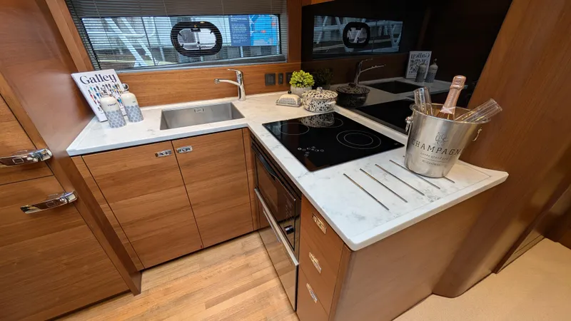  Yacht Photos Pics Modern kitchen in 2021 Princess V50 yacht with sleek countertops and appliances.