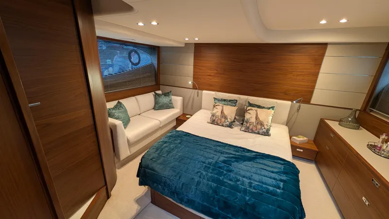  Yacht Photos Pics Luxurious 2021 Princess V50 yacht bedroom with elegant decor and plush bedding.