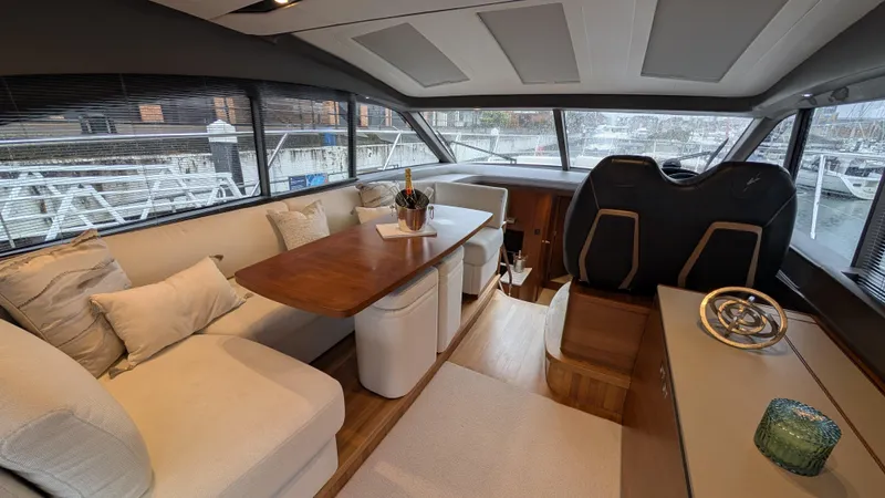  Yacht Photos Pics Luxurious interior of 2021 Princess V50 yacht with elegant seating and dining area.