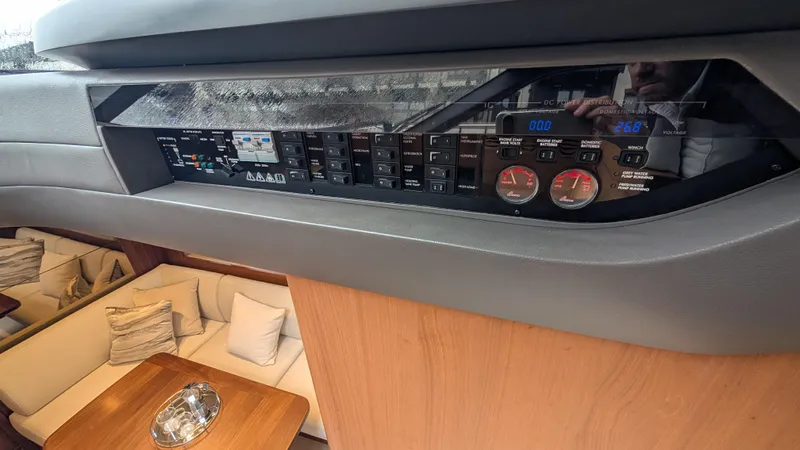  Yacht Photos Pics Control panel inside 2021 Princess V50 yacht, featuring modern switches and gauges.