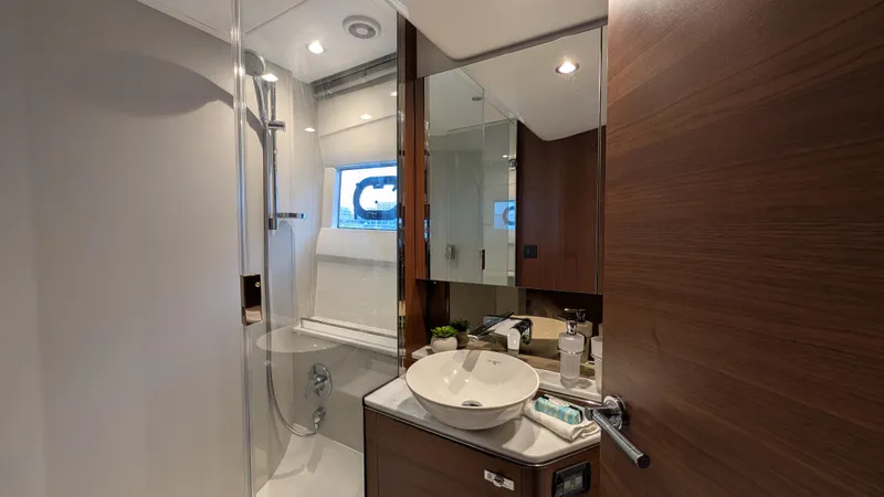  Yacht Photos Pics Luxurious bathroom in 2021 Princess V50 yacht with modern fixtures and elegant design.