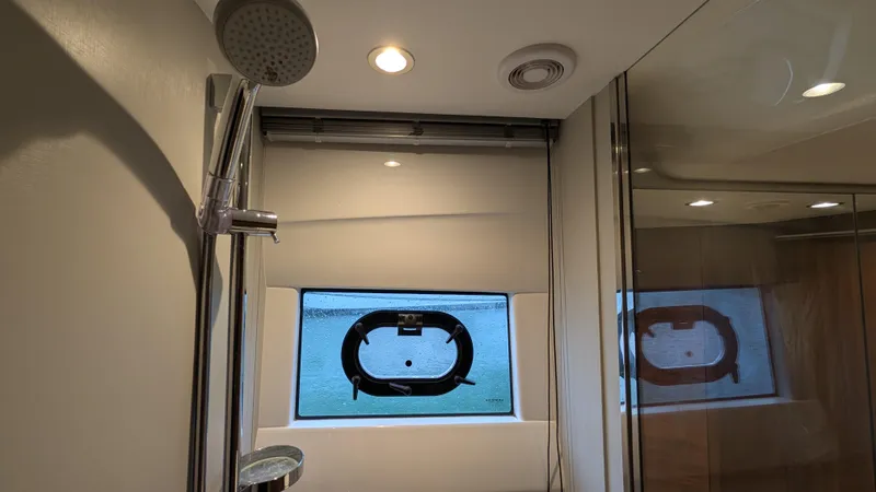  Yacht Photos Pics Modern bathroom in 2021 Princess V50 yacht with shower and porthole window.