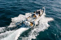 2020 Capelli Tempest 40 boat cruising on open water, aerial view.