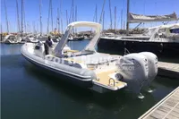 2020 Capelli Tempest 40 boat docked in marina with twin outboard engines.